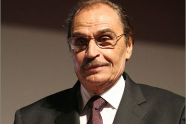 Egypt's veteran actor Izzat al-Alayli receives a life achievement award at the closing ceremony of the Sixth Muscat Film Festival in the Omani capital