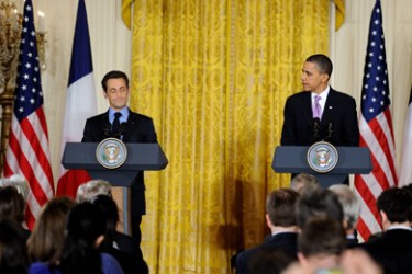 French President Nicolas Sarkozy listens as his US counterpart Barack Obama speaks during a joint press conference in the East Room of the White House in Washington on March 30, 2010 following their meeting. Sarkozy arrived for his first White House talks with President Barack Obama on March 30, pressing for strong sanctions against Iran and action on climate change.