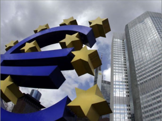 A sculpture showing the euro currency sign is seen in front of the European Central Bank (ECB) headquarters (R) in Frankfurt April 1, 2010.
