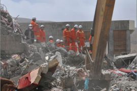Rescuers search for survivors who are buried in the rubble of a collapsed building on April 15, 2010 after a 6.9-magnitude earthquake hit Yushu county in northwest China's Qinghai province on April 14. Rescuers with shovels and bare hands clawed through rubble