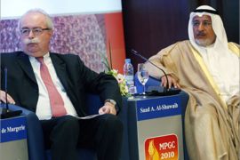 Christophe de Margerie (L), chief executive officer of TOTAL, and Saad al-Shuwaib (R), chief executive officer of Kuwait Petroleum Corporation, attend the Middle East Petroleum