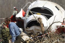 Investigators work at the site of a Polish government Tupolev Tu-154 aircraft crash in Smolensk April 13, 2010. Officials said a memorial service for all 96 victims of the crash would be held on Saturday and that a state funeral for Lech Kaczynski and his wife