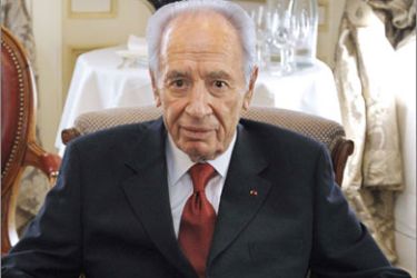 Israeli President Shimon Peres poses prior to a meeting France's Minister for Foreign Affairs Bernard Kouchner (unseen) on April 14, 2010 in Paris. Shimon Peres called on April 13, 2010 for stalled negotiations with Palestinians to be "urgently" relaunched,