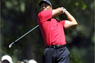 epa02081874 (FILE) A file photograph taken 12 April 2009 of Tiger Woods of the US hits his tee shot on the fourth hole during the final round of the 2009 Masters Tournament at Augusta National in Augusta, Georgia, USA. Tiger Woods is to return to competitive golf at the Masters, starting on 8 April, it has been announced 16 March 2010. The world number one's last tournament appearance was on 15 November - when he won