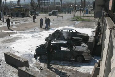 Interior Ministry specialists investigate the site of a bombing in Karabulak April 5, 2010. A suicide bomber killed at least two policemen in Russia's Ingushetia region on Monday, the latest in a spate of attacks that underscore the threat from an Islamist insurgency