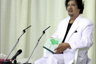 afp : Libyan leader Moamer Kadhafi addresses a gathering late on April 15, 2010 in a huge tent erected in the desert near the eastern coastal city of Sirte during