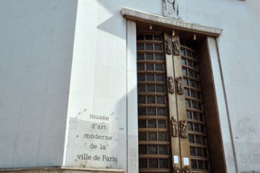 A picture taken on May 20, 2010 shows information notes on the door of the Paris' Musee d'Art Moderne (Paris modern art museum), closed after five works including paintings