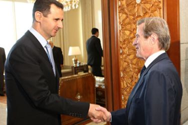 A handout picture released by French Foreign Ministry shows Syrian President Bashar al-Assad (L) shaking hands with French Foreign Minister Bernard Kouchner at Al-Shaab palace in Damascus on May 23, 2010. Kouchner met with Assad amid tensions over Syrian arms supplies to the Lebanese militant group Hezbollah. AFP PHOTO