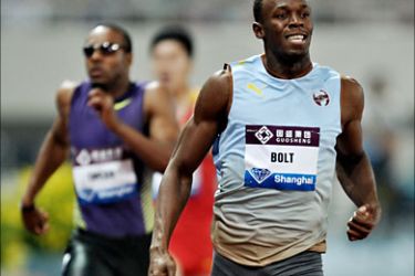 f_Jamaica's Usain Bolt wins the men's 200m event during the Shanghai IAAF Diamond league athletics meeting in Shanghai on May 23, 2010