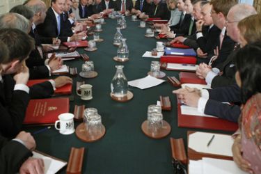 Britain's new Conserative Party Prime Minister, David Cameron (6th L), chairs the first Cabinet meeting of the new Conservative/Liberal Democrat coalition Government