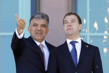 REUTERS/ Turkey's President Abdullah Gul (L) chats with his Russian counterpart Dmitry Medvedev after a welcoming ceremony at the Presidential Palace of Cankaya in Ankara May 12, 2010.