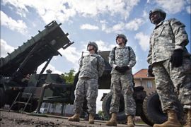 f_US soldiers stand on May 26, 2010 in front of a Patriot missile battery at an army base in the northern Polish town of Morag. Polish and US officials unveiled on May 26