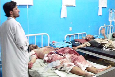 AFP - A doctor stands by the beds of the wounded in a hospital in Kandahar on June 9, 2010 after an explosion at a wedding at Nangahaan in Arghandab district. At least 39 people were