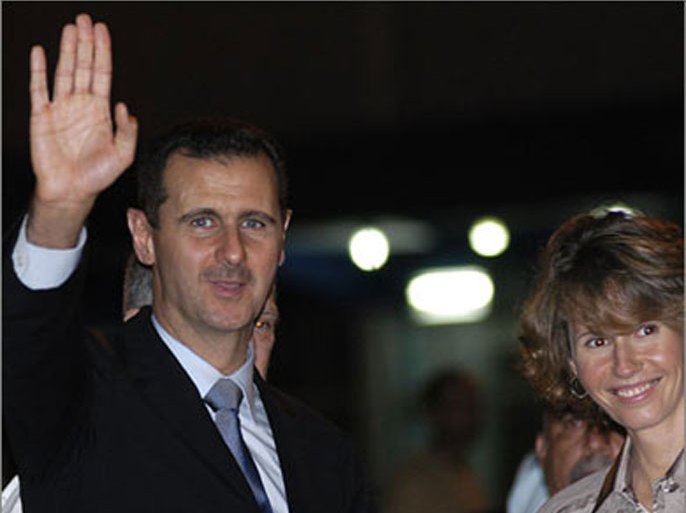 Syrian President, Bashar Al Assad (L), waves alongside his wife Asma al-Assad, upon their arrival at Jose Marti International Airpor in Havana on June 27, 2010. Assad is in Cuba as part of a Latin American tour aimed at consolidating ties, which already took him to