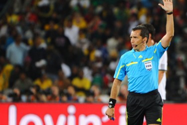 Uruguayan referee Jorge Larrionda (R) makes a sign during the 2010 World Cup round of 16 football match Germany vs. England on June 27, 2010 at Free State stadium
