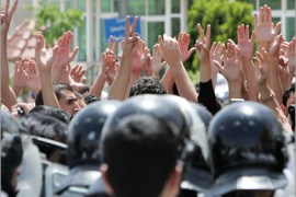 REUTERS / Jordanian protesters raise their hands during a protest against the Israeli raid on ships carrying humanitarian aid to the Gaza Strip, near the Israeli embassy in Amman June 4,