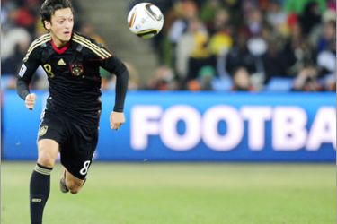 AFP - Germany's midfielder Mesut Ozil runs with the ball during the Group D first round 2010 World Cup football match Germany versus Ghana on June 23, 2010 at Soccer City stadium in Soweto, suburban Johannesburg.