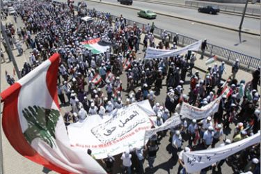 Lebanese and Palestinians march towards the United Nations building in the capital Beirut on June 27, 2010, to demand civil rights in Lebanon for