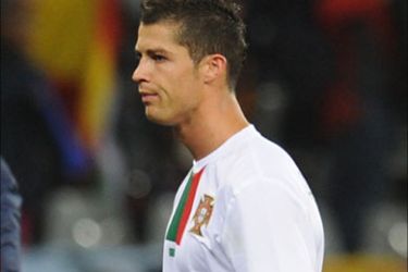 f_Portugal's striker Cristiano Ronaldo walks out after the 2010 World Cup Round of 16 football match between Spain and Portugal on June 29, 2010