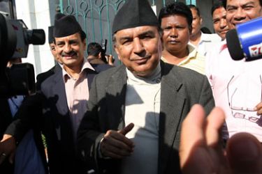 Nepali Congress party Vice-Chairman Ram Chandra Paudel speaks with media upon leaving parliament in Kathmandu on July 20, 2010 after filing his candidacy in the prime minister's election slated for the following day.