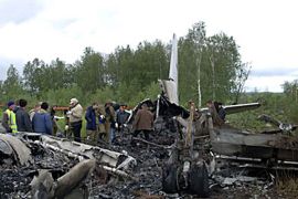 r_Investigators work at the site of a Russian passenger plane crash near the town of Igarka in the Arctic, about 3,000 km (1,850 miles) northeast of Moscow, August 3, 2010.
