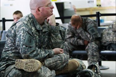 r_U.S. soldiers wait for their flight back home at the lobby of Balad Base, 80 km (50 miles) north of Baghdad August 27, 2010. The U.S. military said on August 24, 2010