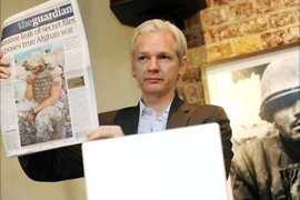 WikiLeaks founder Julian Assange shows an issue of the British daily The Guardian during a press conference at the Frontline Club in London, Britain, 26 July 2010, to discuss about the 75,000 Afghan war documents that the organization made available
