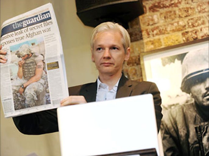 WikiLeaks founder Julian Assange shows an issue of the British daily The Guardian during a press conference at the Frontline Club in London, Britain, 26 July 2010, to discuss about the 75,000 Afghan war documents that the organization made available