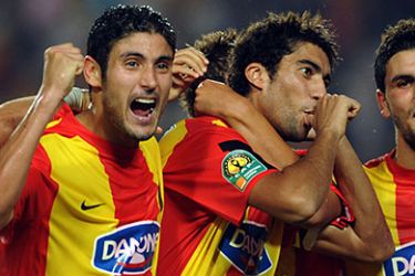 f_Tunisia Esperance's players hug their teammate Oussama Darragi (C) after scoring against Zimbabwe Dynamos FC during their African Champions League football match group