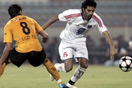 Kuwait's Waleed Ali (R) fights for the ball with Qadsia's Bader Saleh Al-Shaikh during their Kuwait Supercup soccer match in Kuwait City August 16,