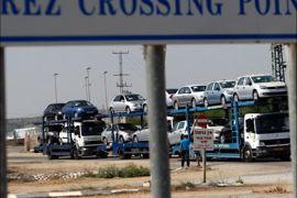 r_Cars that underwent a security check at Israel's Erez Crossing are transported towards Kerem Shalom crossing before their transfer to Gaza September 20, 2010.