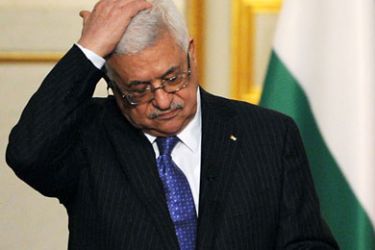 Palestinian leader Mahmud Abbas gestures during a join press conference with French President Nicolas Sarkozy (not pictured) on September 27, 2010 at the Elysee Palace in Paris, after a working lunch focused on the Israeli-Palestine peace negotiations. Mahmud Abbas will consult Arab governments on October 4 before deciding whether to continue talks with Israel following the end of the settlement freeze, his spokesman said today. AFP PHOTO / LIONEL BONAVENTURE