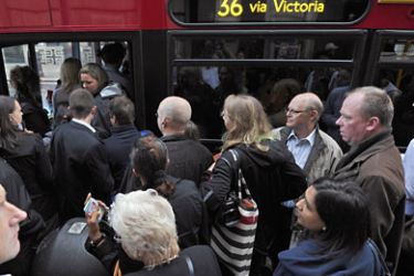 AA003 - London, Greater London, UNITED KINGDOM : Commuters queue for a bus at Victoria Station in central London, on September 7, 2010, as workers on London's Underground train system started a 24-hour strike over staffing cuts. Thousands of workers walked out during the evening