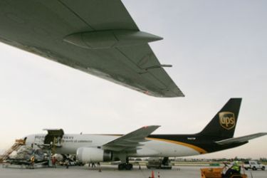 (FILES) -- In this October 20, 2006 file photo, airport workers load a United Parcel Service (UPS) at the company's air hub for Latin America in Miami, Florida. A cargo aircraft belonging to the US courier UPS crashed on September 3, 2010 evening near Dubai international airport, a civil aviation official told AFP