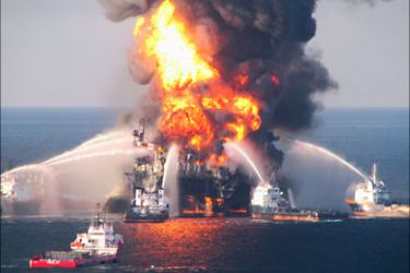 r_Fire boat response crews battle the blazing remnants of the off shore oil rig Deepwater Horizon, off Louisiana, in this April 21, 2010, handout file photo. With a final shot of cement, BP Plc