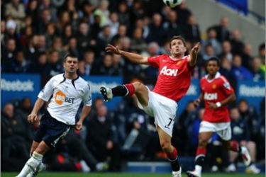 Manchester United's English forward Michael Owen controls the ball against Bolton Wanderers during their English Premier League football match at The Reebok Stadium in Bolton, north-west England,