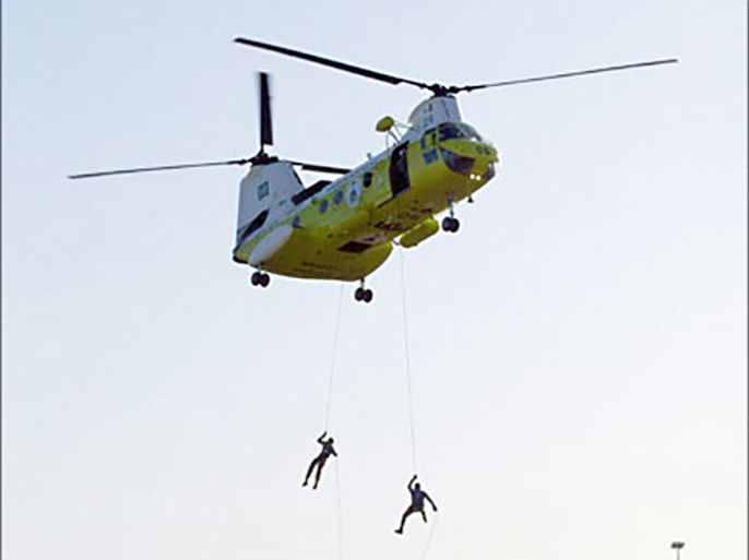 epa-Saudi Arabian commandos rappel from a helicopter during a display of the security measures being instigated to safeguard the Haj (Moslem piligrimage)