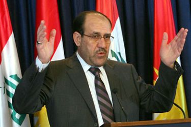 (FILES)--Iraqi Prime Minister Nuri al-Maliki gestures as he speaks during a joint press conference with Massud Barzani (unseen), president of Iraq's regional Kurdish government, in the northern city of Arbil on August 08, 2010. Maliki, a tough-talking former rebel who spent decades in exile