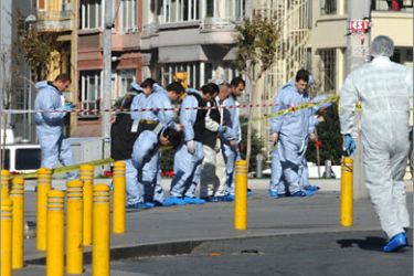 Police forensic experts work at the scene after an explosion in Istanbul's central Taksim Square on October 31, 2010. A suicide bomber blew himself up in the heart of Istanbul on Sunday, wounding