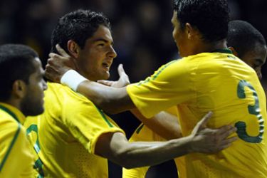 Brazil's Alexandre Silva (C) celebrates scoring during the friendly international football match between Ukraine and Brazil at Pride Park in Derby, central England, on October 11, 2010.