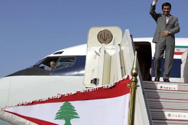 Iranian President Mahmoud Ahmadinejad waves from the stairs of the plane upon his arrival at Beirut's international airport on October 13, 2010, for a controversial visit that will take him close to the border with arch-foe Israel and seen as a boost for key ally the Shiite Muslim movement Hezbollah. AFP PHOTO/STR