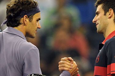 Roger Federer of Switzerland (L) is congratulated by Novak Djokovic of Serbia (R) following their semi-final match at the Shanghai Masters ATP Tennis tournament on October 16, 2010 in Shanghai. Federer defeated Djokovic 7-5, 6-4. AFP PHOTO
