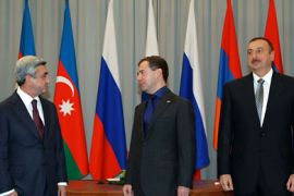 Russian President Dmitry Medvedev (C) meets AzerbaijanI President Ilham Aliev (R) and Armenian President Serge Sarkisian (L) in the southern Russian city of Astrakhan on October 27, 2010