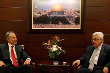 Palestinian president Mahmud Abbas (R) meets with Quartet Middle East envoy Tony Blair at the Palestinian Authority headquarters in the West Bank city of Ramallah on October 19,
