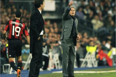 Real Madrid's Portuguese coach Jose Mourinho (R) gestures in front of AC Milan's Brazilian coach Massimiliano Allegri (L) during their Champions league group G football match at Santiago Bernabeu stadium in Madrid on October 19, 2010