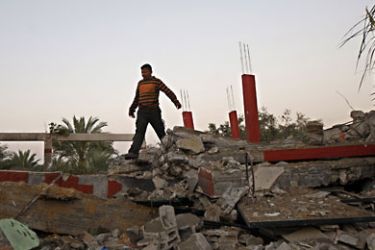A Palestinian man inspects damages following Israeli air raids in the central town of Deir al-Balah in the Gaza Strip on November 19, 2010 after a rocket and mortars were fired into Israel from the coastal enclave. AFP
