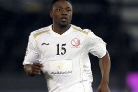 Lekhwiya's Aruna Dindane of Ivory Coast runs with the ball during his team's Qatar Stars League football match against Al-Sadd club in Doha on