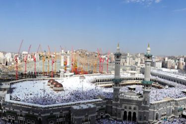 Muslim pilgrims perform Friday prayers in front of the Grand Mosque in Mecca, on November 12, 2010, as some 2.5 million Muslim pilgrims are descending on the holy