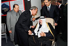 R_Saudi Arabia's King Abdullah (seated) is greeted by Saudi Arabia's Foreign Minister Prince Saud Al Faisal upon his arrival in New York November 23, 2010