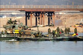 r_Soldiers from a South Korean army armoured division take part in an annual river-crossing exercise against a possible attack from North Korea on the Han river in Yeoju, about